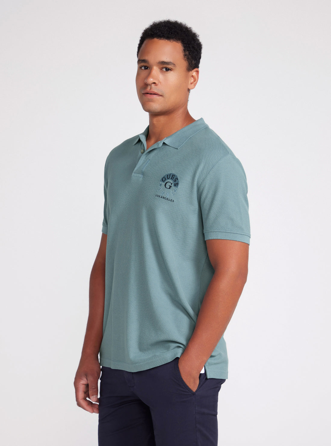 Ocean Blue Ground Logo Polo Shirt | GUESS Men's Apparel | side view