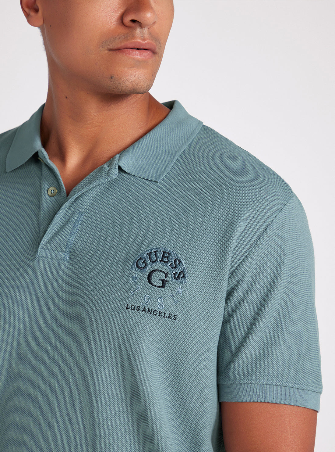 Ocean Blue Ground Logo Polo Shirt | GUESS Men's Apparel | detail view