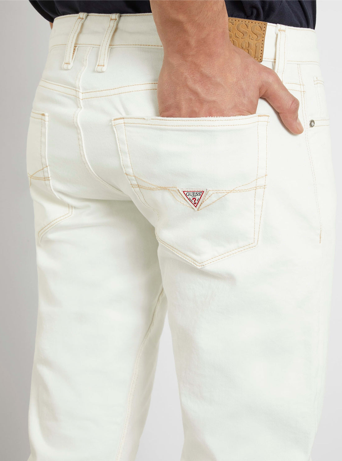 White Low-Rise Slim Tapered Jeans in White Wash