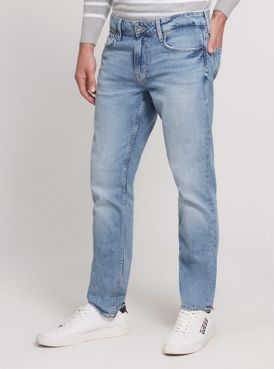 GUESS Low Rise Slim Tapered Denim Jeans in Light Wash side view