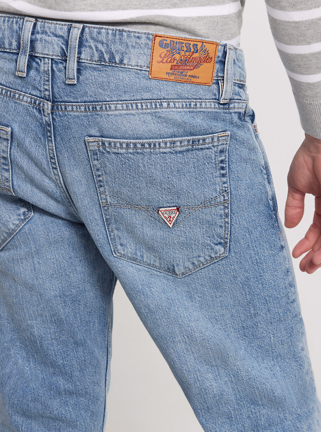 GUESS Low Rise Slim Tapered Denim Jeans in Light Wash detail view