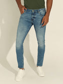GUESS Mens Low-Rise Miami Skinny Denim Jeans in Carry Light Wash M1YAN1D4GV6 Front View